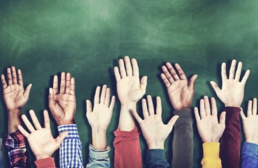 ClassroomHands.Shutterstock