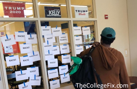 VIDEO: Black student plasters signs stating ‘racist’ all over UW