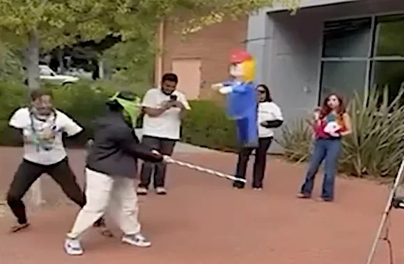 Faculty member celebrates as students engage in ‘decapitation’ of Trump piñata